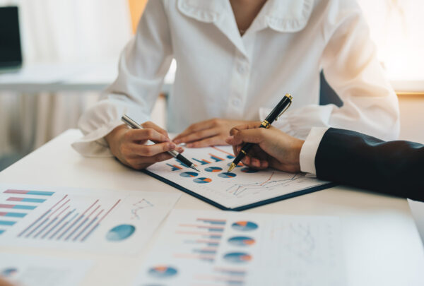 Close up business team hands at working with financial plan, meeting, discussion, brainstorming on the office desk Close up business team hands at working with financial plan, meeting, discussion, brainstorming on the office desk,